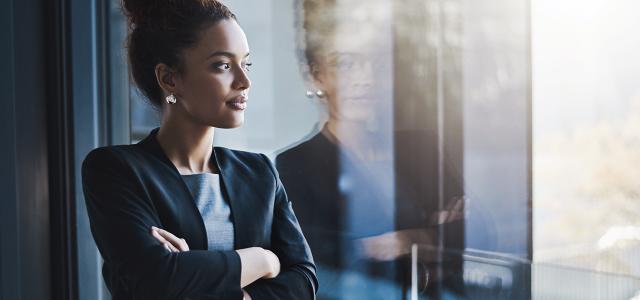 business woman looking outside window